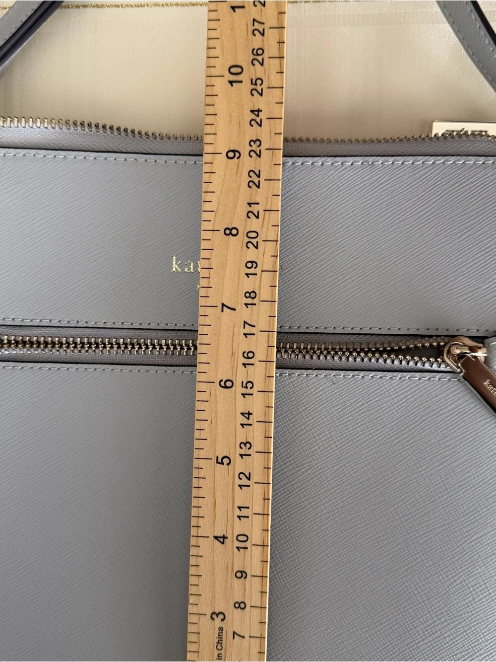 kate spade light gray saffiano leather messenger bag with gold hardware